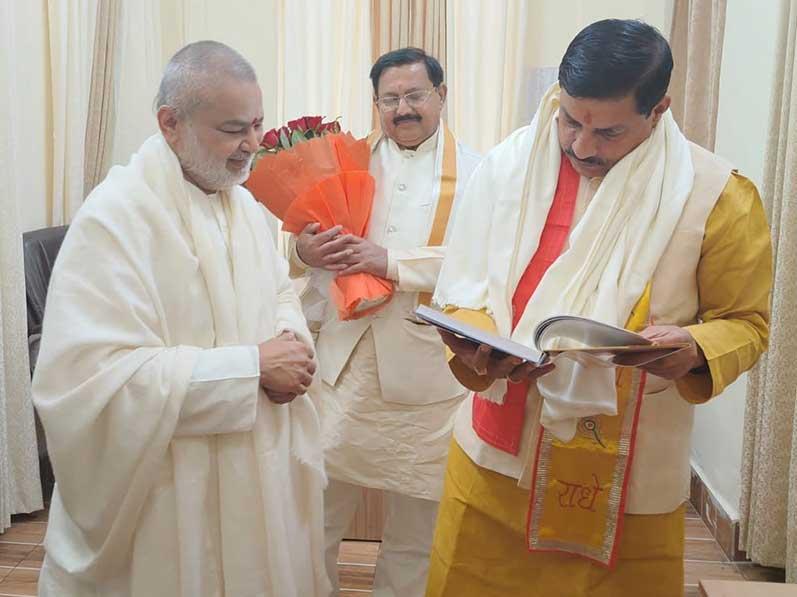 Brahmachari Girish Ji and Shri Arvind Singh Rajpoot (The Registrar of Maharishi Mahesh Yogi Vishwavidyalaya) has greeted Honourable Dr. Mohan Yadav Ji on behalf of Maharishi Organisation  for becoming Chief Minister of Madhya Pradesh and honoured him with flower bouquet and shawl. Brahmachari Ji has presented his book ''Brahmachari Girish under Divine Umbrella of His Holiness Maharishi Mahesh Yogi'' to honourable Chief Minister, who immediately turned the pages and reviewed the book.