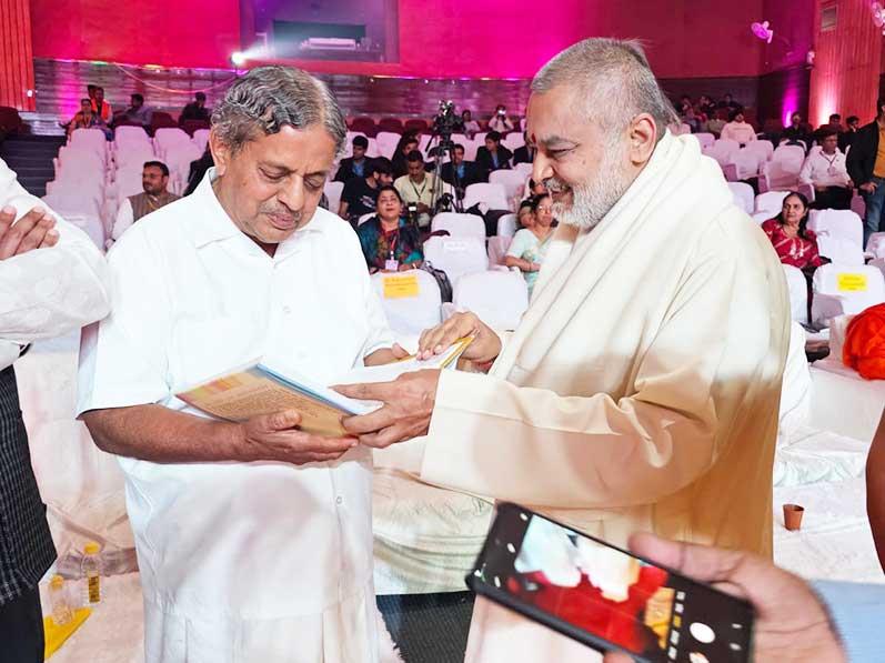 Brahmachari Girish Ji presented his book ''Brahmachari Girish under Divine Umbrella of His Holiness Maharishi Mahesh Yogi'' to famous Guru Doctor Nagendra ji, Chancellor of S. Vyasa University, Bengaluru. Doctor Nagendra ji invited Girish ji to visit his University.